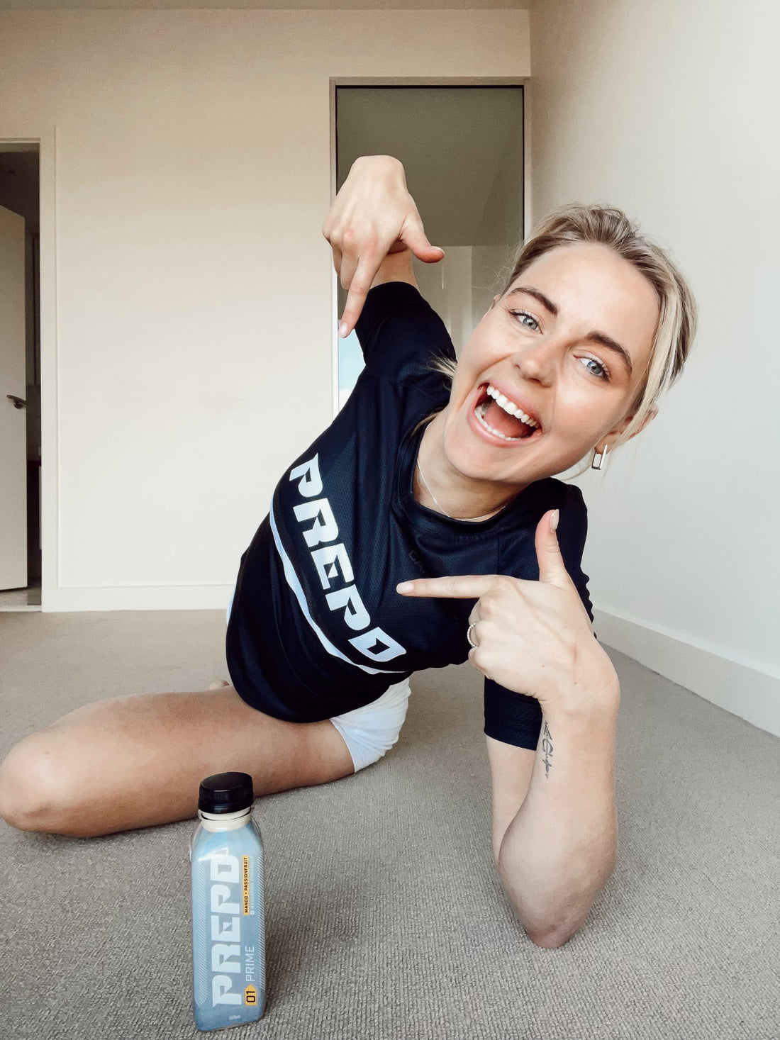 sarah jeavons wearing prepd shirt and prepd bottle